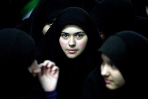Iranian women attend a ceremony marking