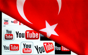YouTube logos displayed on a laptop screen partially covered with Turkey's national flag in this photo illustration taken in Ankara