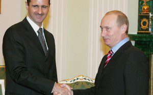 Russia's President Vladimir Putin (R) an