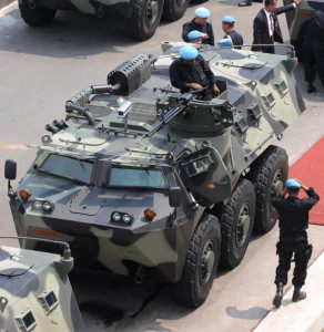 Indonesian Army soldiers aboard armored