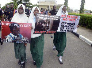School pupils hold signs as members of Lagos based civil society groups hold rally calling for the release of missing Chibok school girls at the state government house, in Lagos, Nigeria, on May 5, 2014. Boko Haram on Monday claimed the abduction of hundreds of schoolgirls in northern Nigeria that has triggered international outrage, threatening to sell them as "slaves". "I abducted your girls," the Islamist group's leader Abubakar Shekau said in the 57-minute video obtained by AFP, referring to the 276 students kidnapped from their boarding school in Chibok, Borno state, three weeks ago. AFP PHOTO / PIUS UTOMI EKPEIPIUS UTOMI EKPEI/AFP/Getty Images