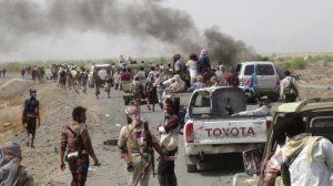 Fighters loyal to Yemen's President Abd-Rabbu Mansour Hadi gather on a road leading to the  al-Anad military and air base in the country's southern province of Lahe