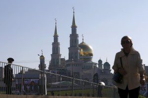 Pedestrian walks near the Moscow Grand Mosque before an opening ceremony in Moscow